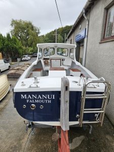 Rear of a PLyouth Pilots boat with steps
